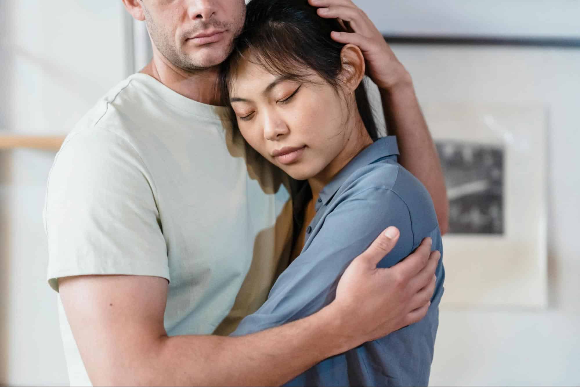 A couple hugging.