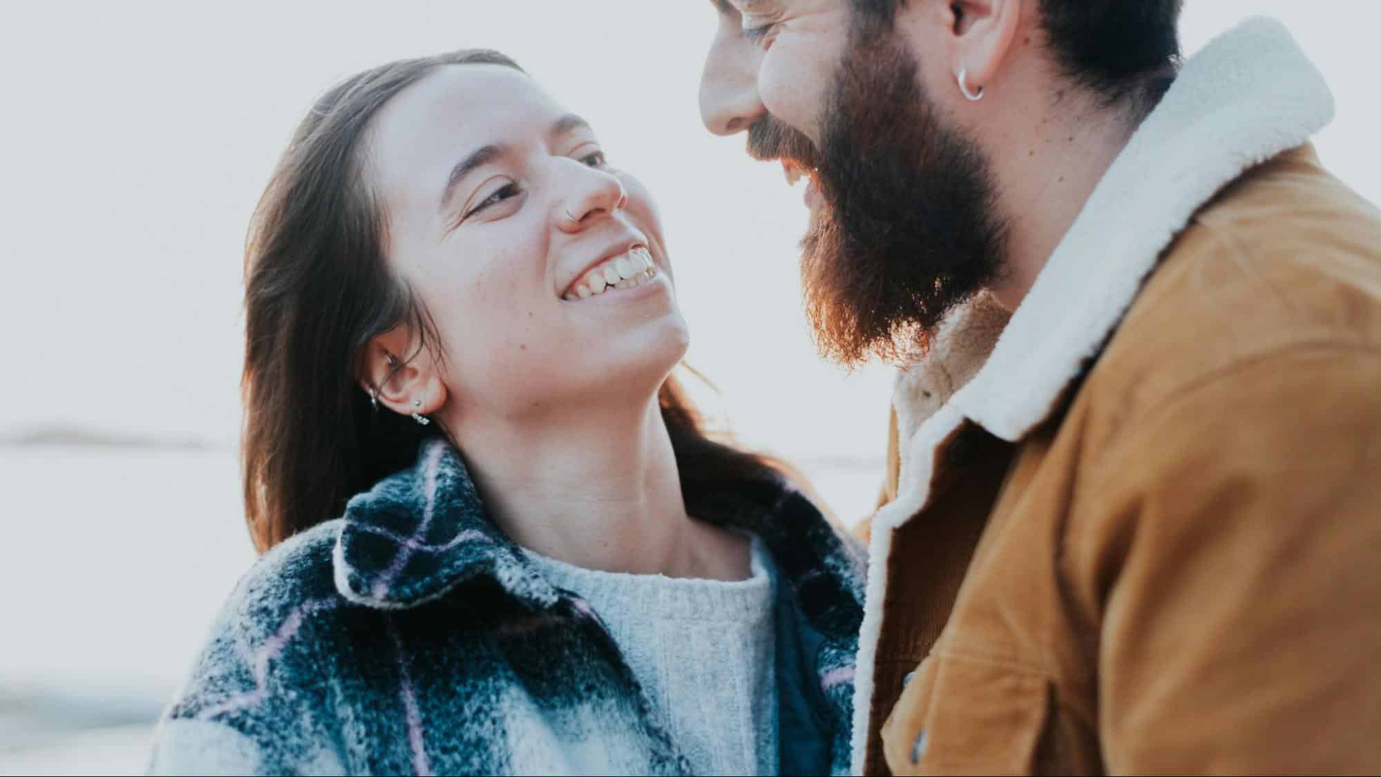 A man and woman smiling at each other