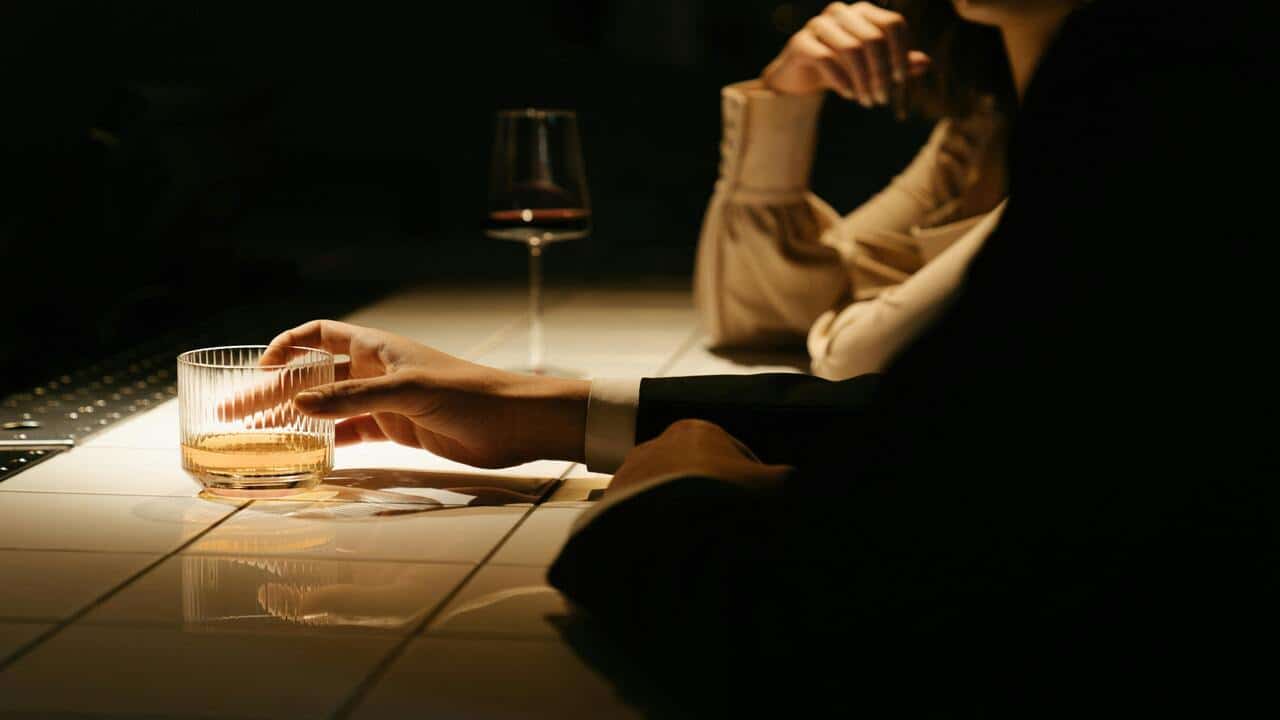 A man and a women at a bar