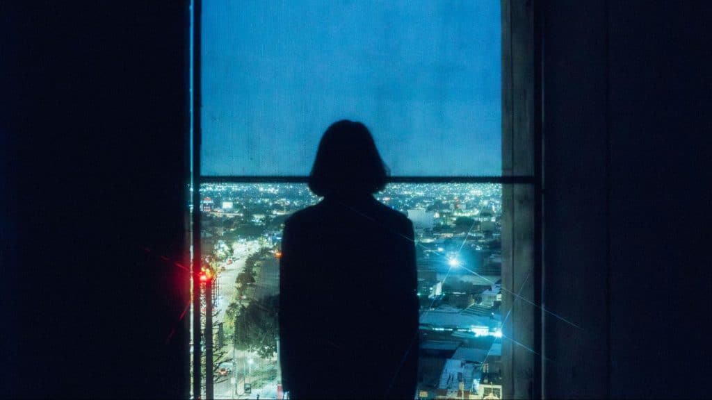 Woman looking at the night lights