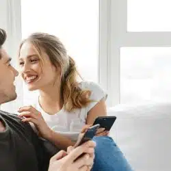 Happy man and woman looking in each other's eyes and smiling.