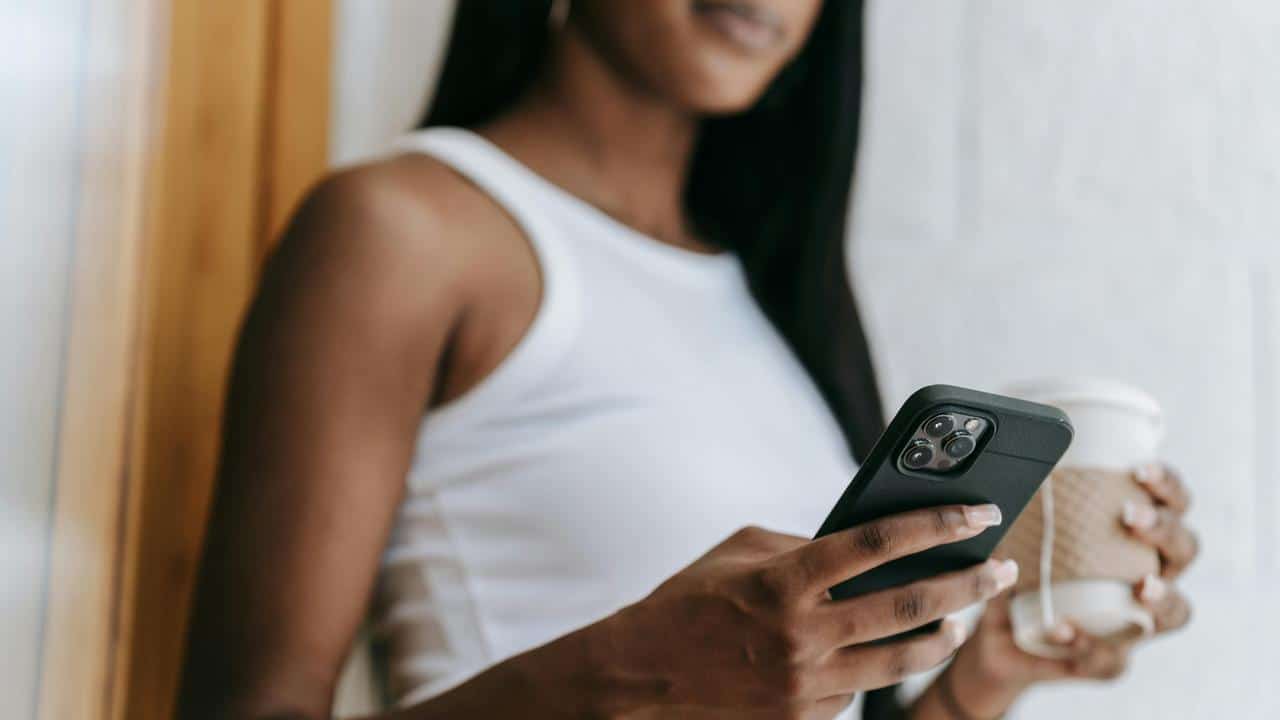 A woman holding a smartphone