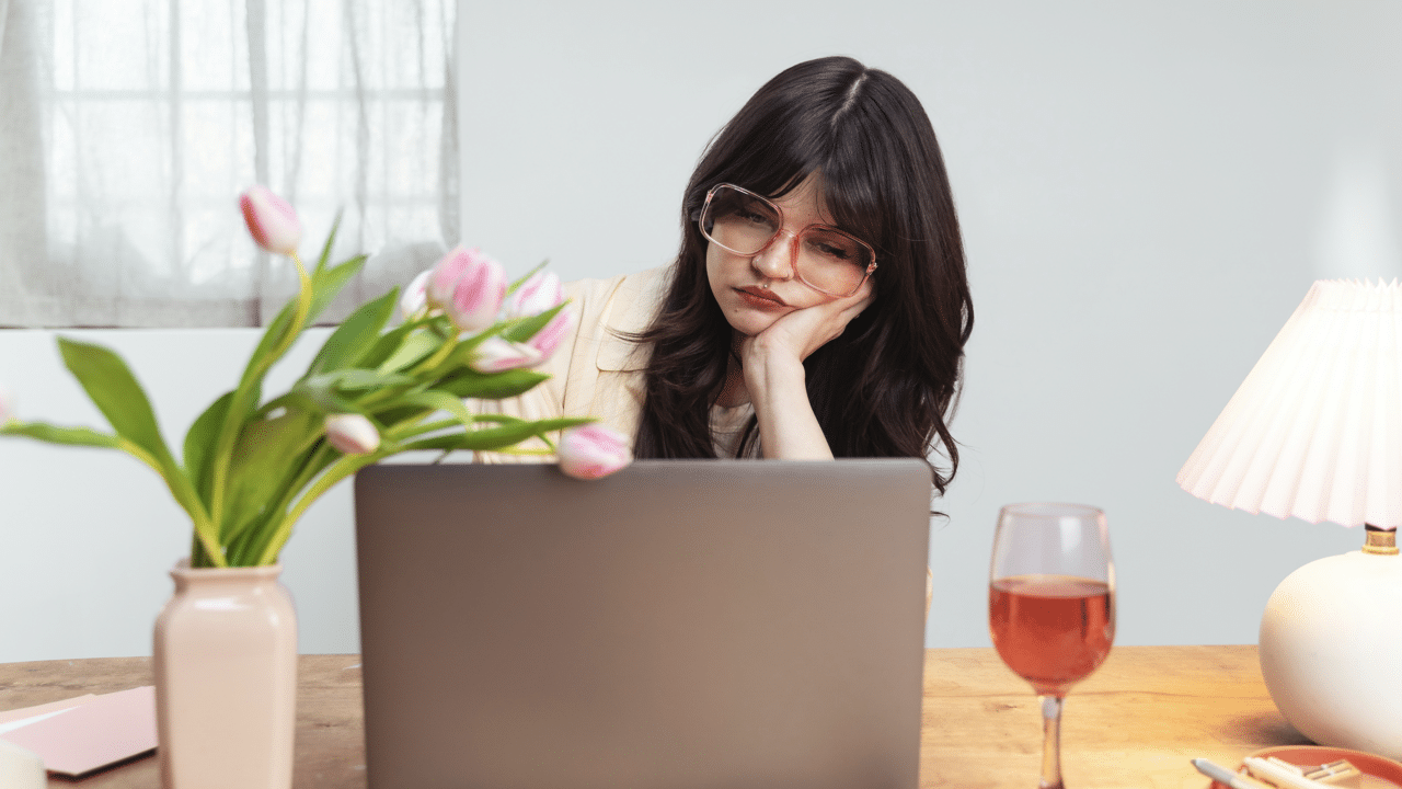A woman looking sad while working