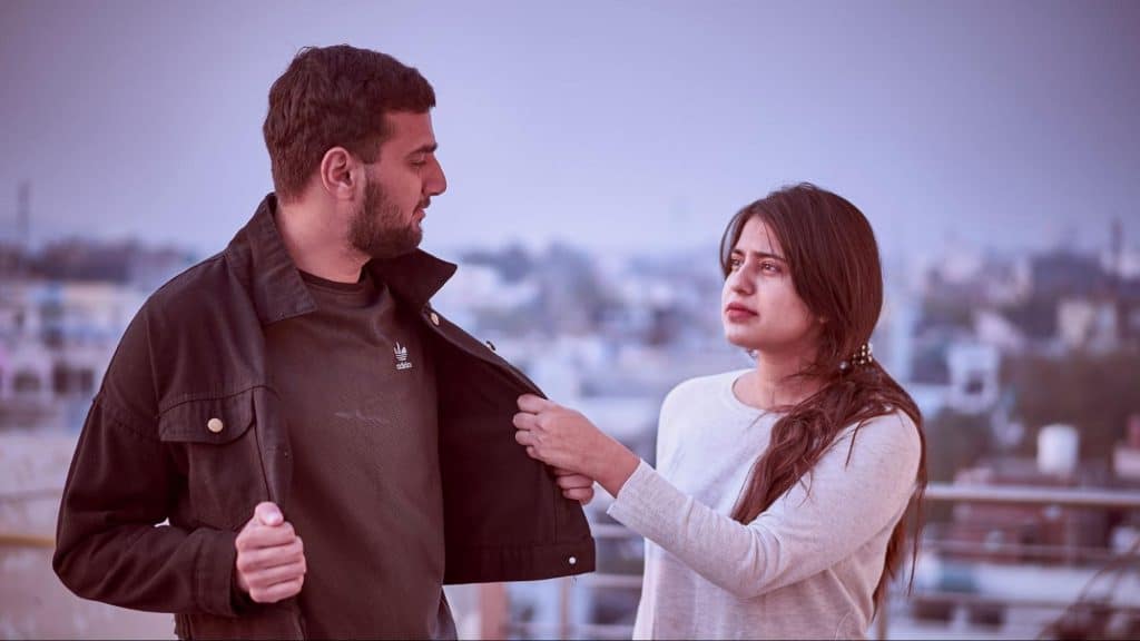 A man approaching woman
