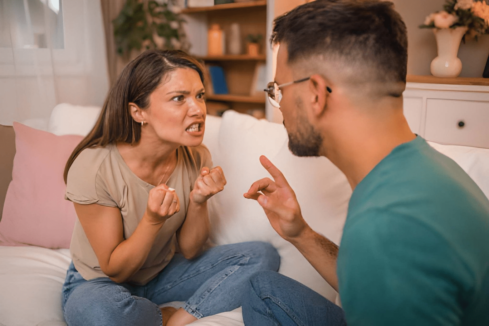 Couple has an argument while sitting in the living room