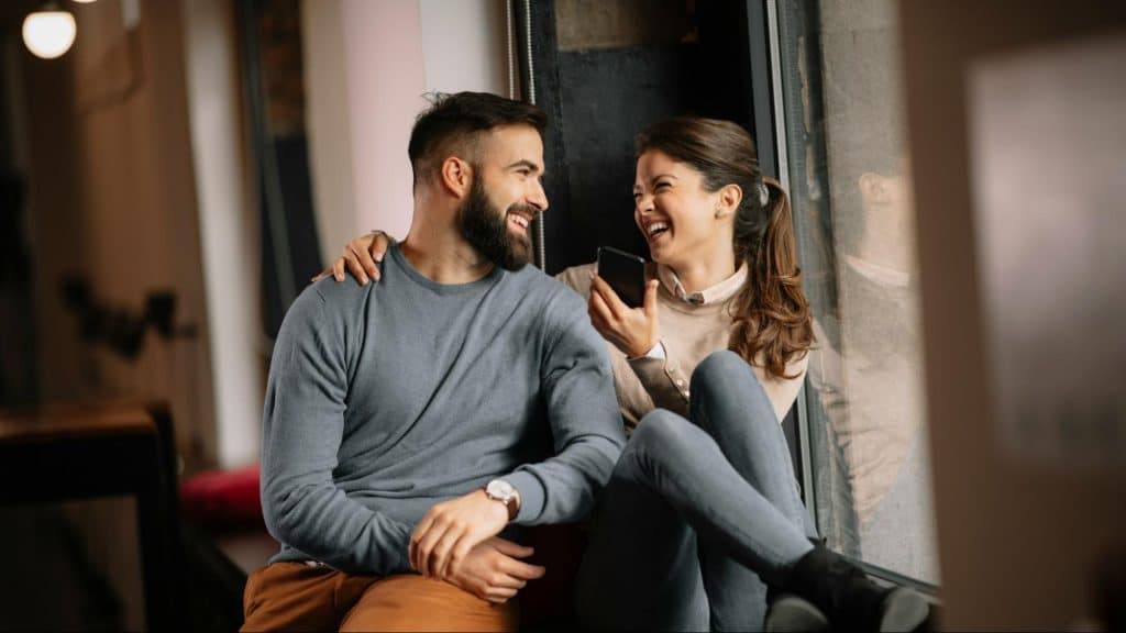 A man and woman smiling at each other