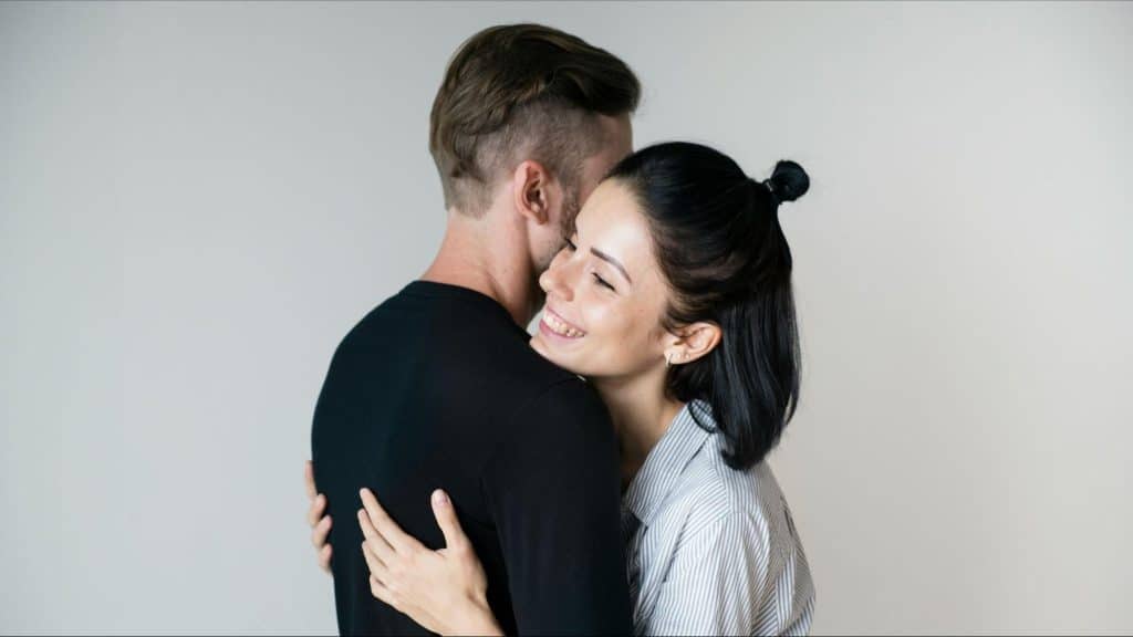 Woman hugging a man