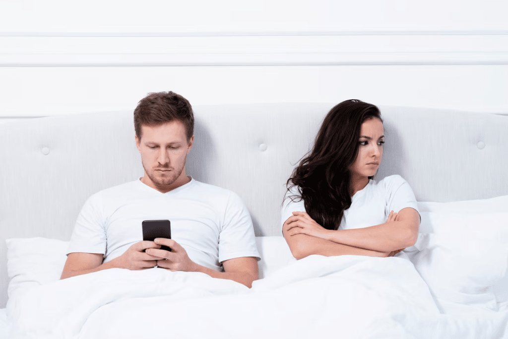 A man ignoring a stressed woman