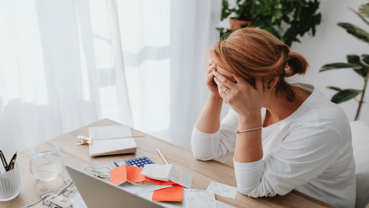 A woman stressed over receipts
