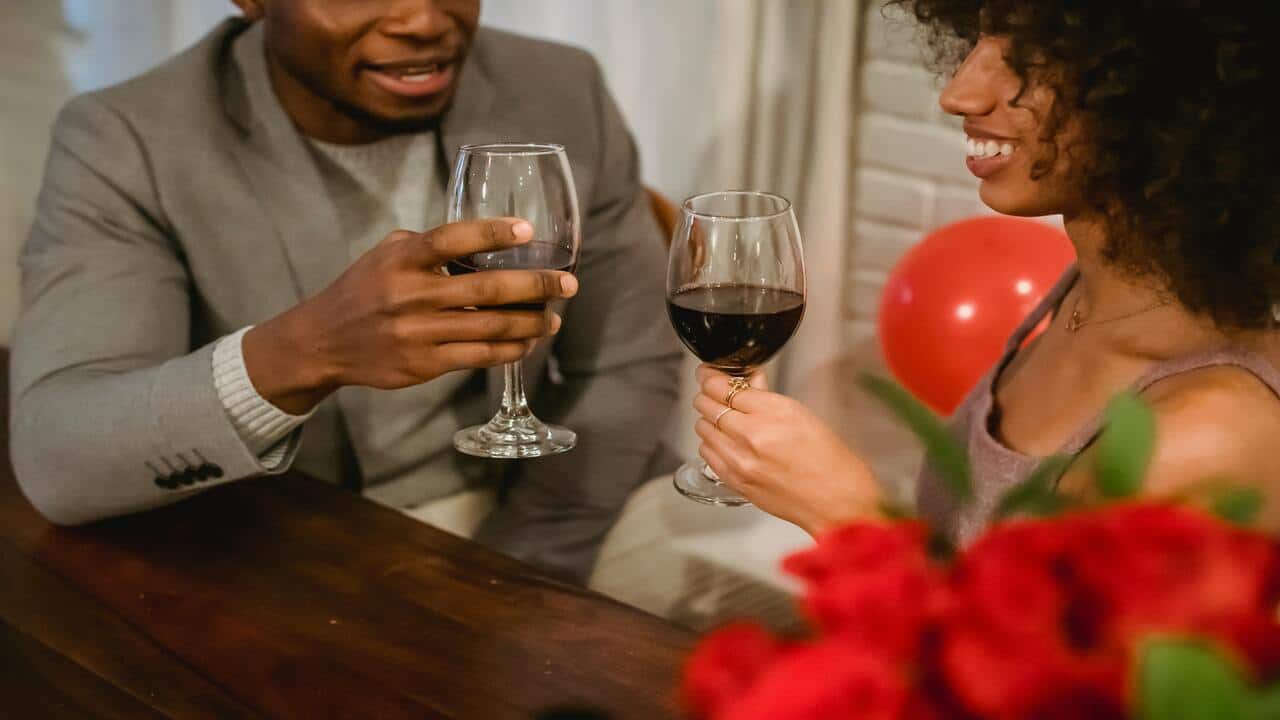 A couple having wine together