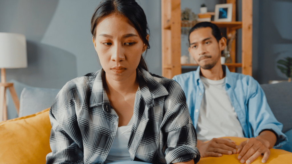Woman thinking and a man looking at her