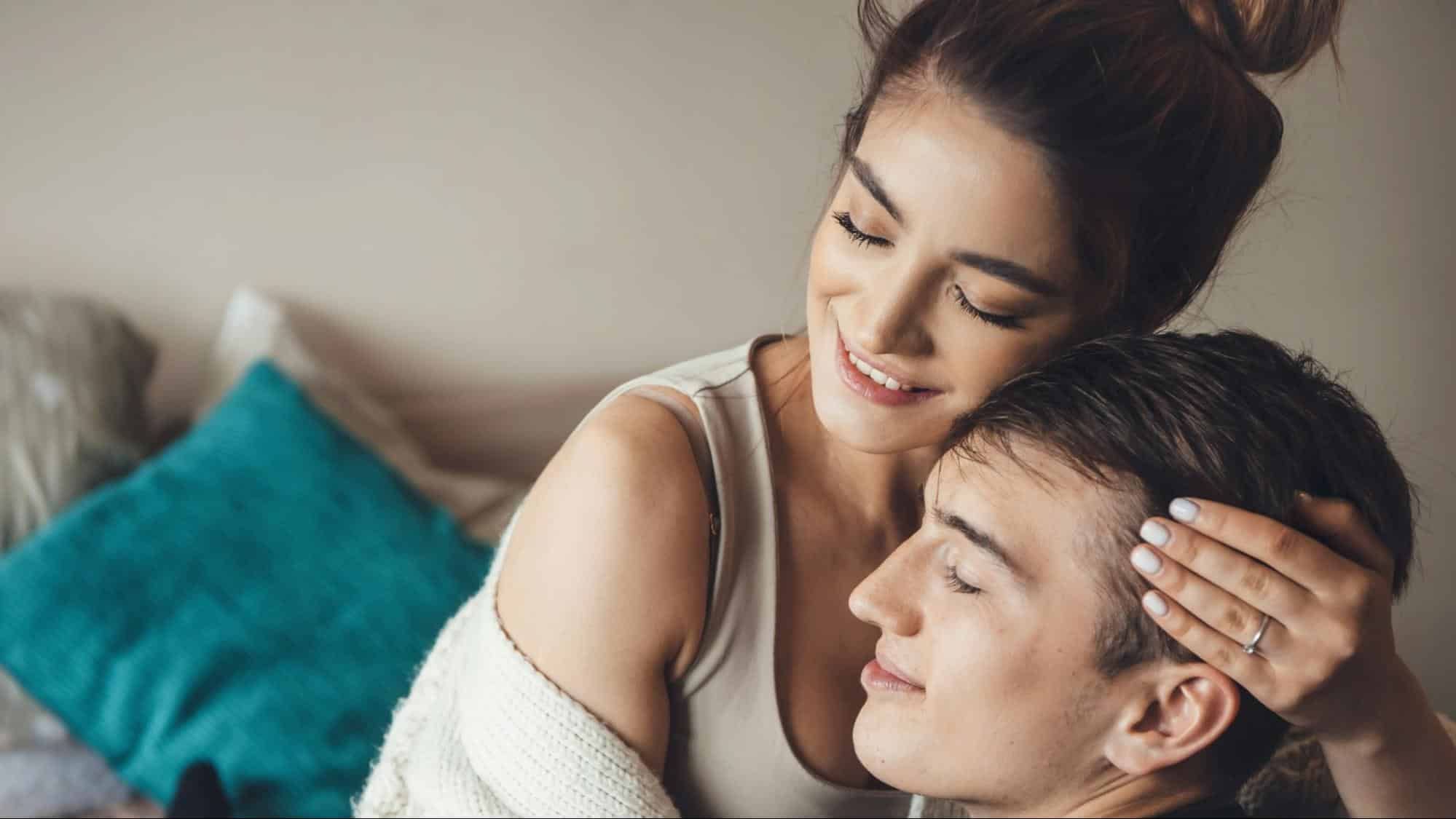 A man and woman hugging each other