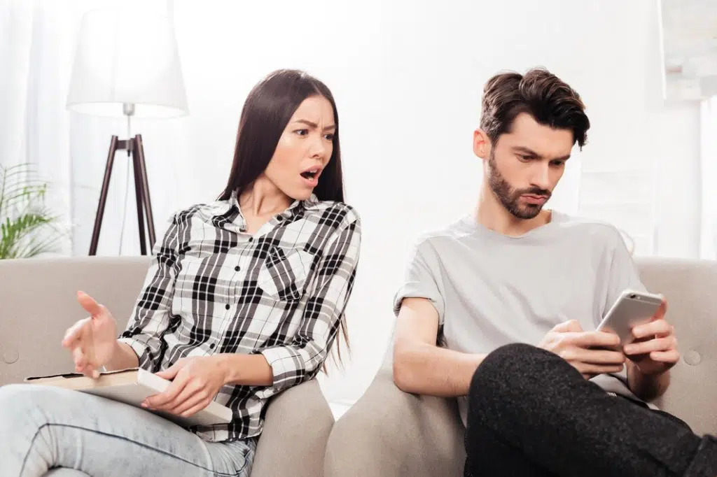 Angry woman at husband on phone