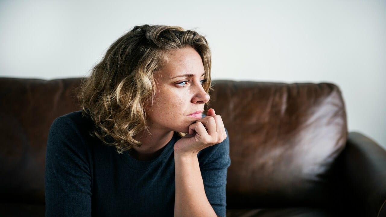 A woman thinking at home