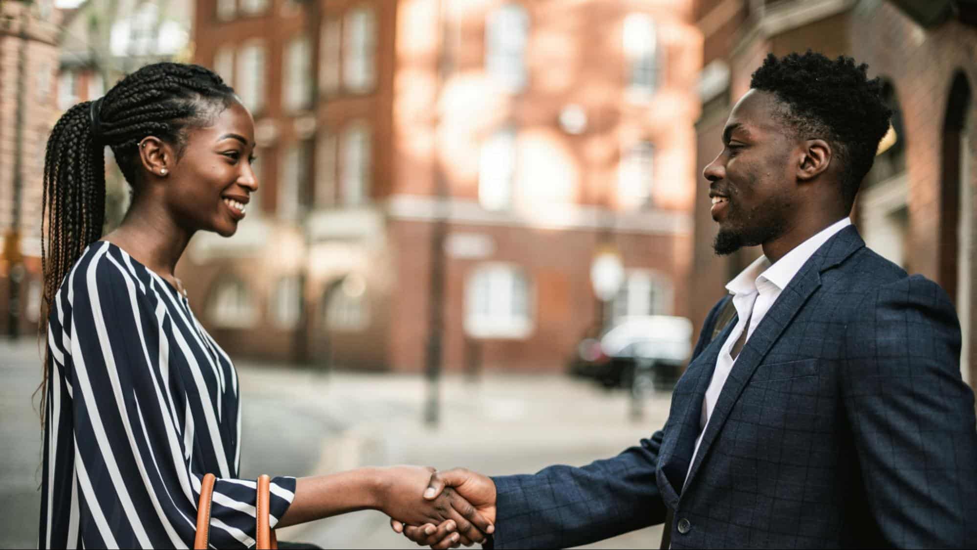A couple shaking hands