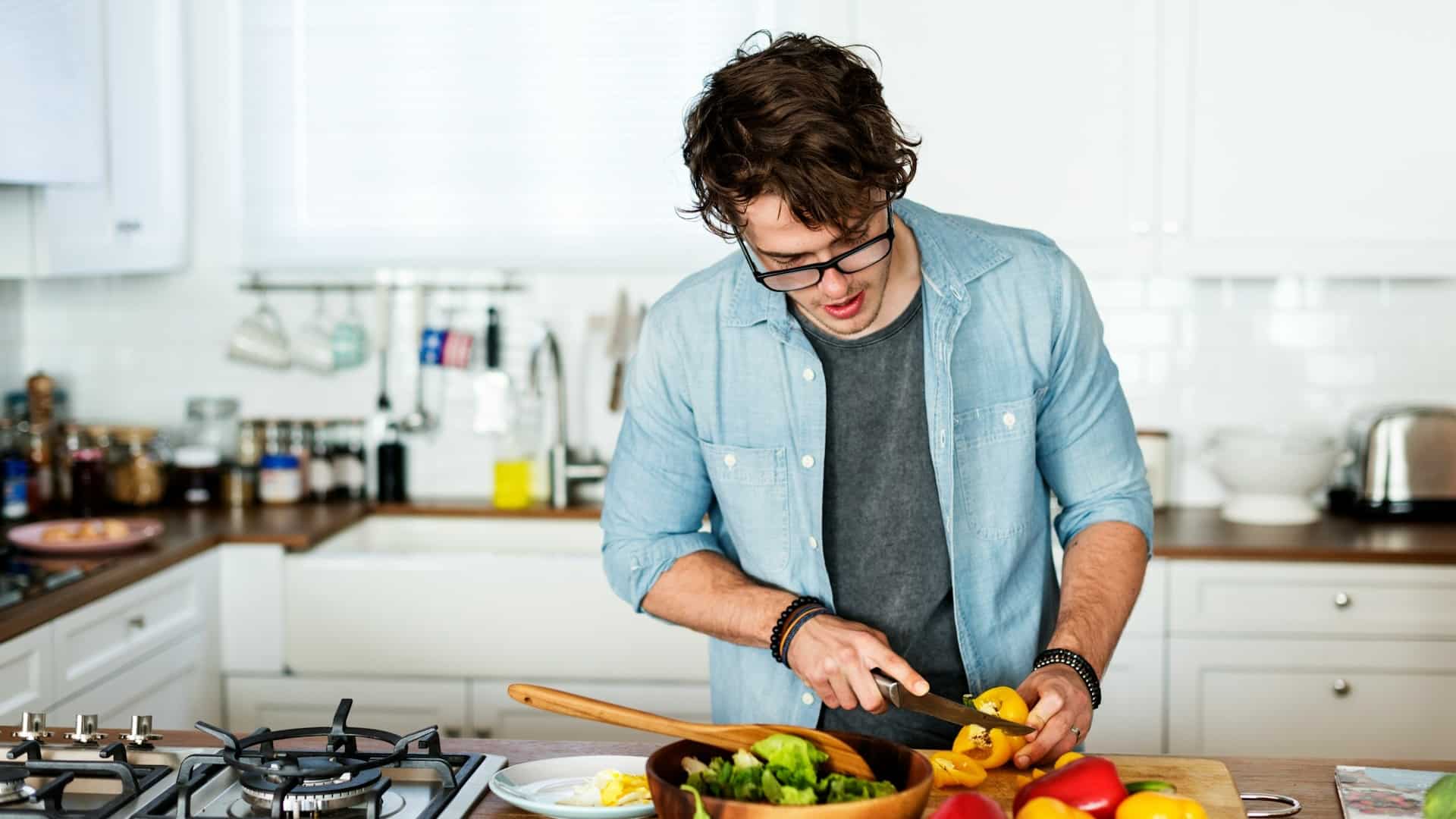A man cooking in the kitchen.