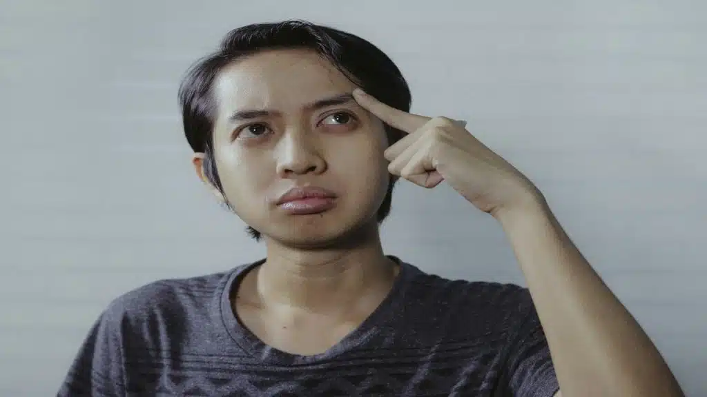 person looking confused while thinking