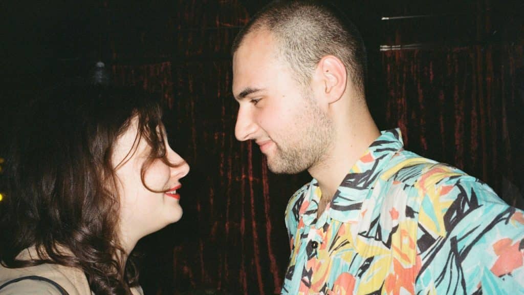 A man and a woman standing next to each other.