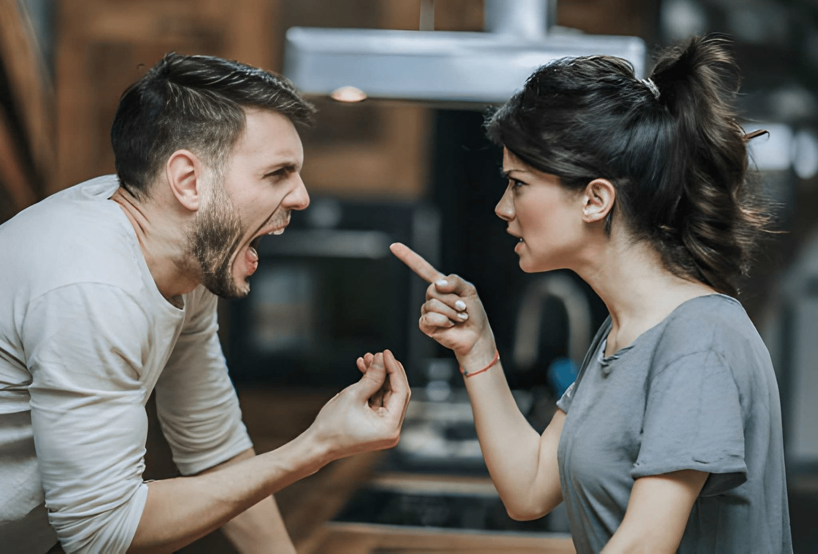 Aggressive couple arguing about their problems at home