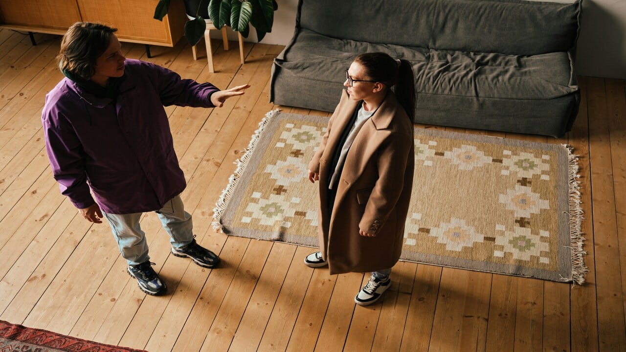 A couple fighting in the living room