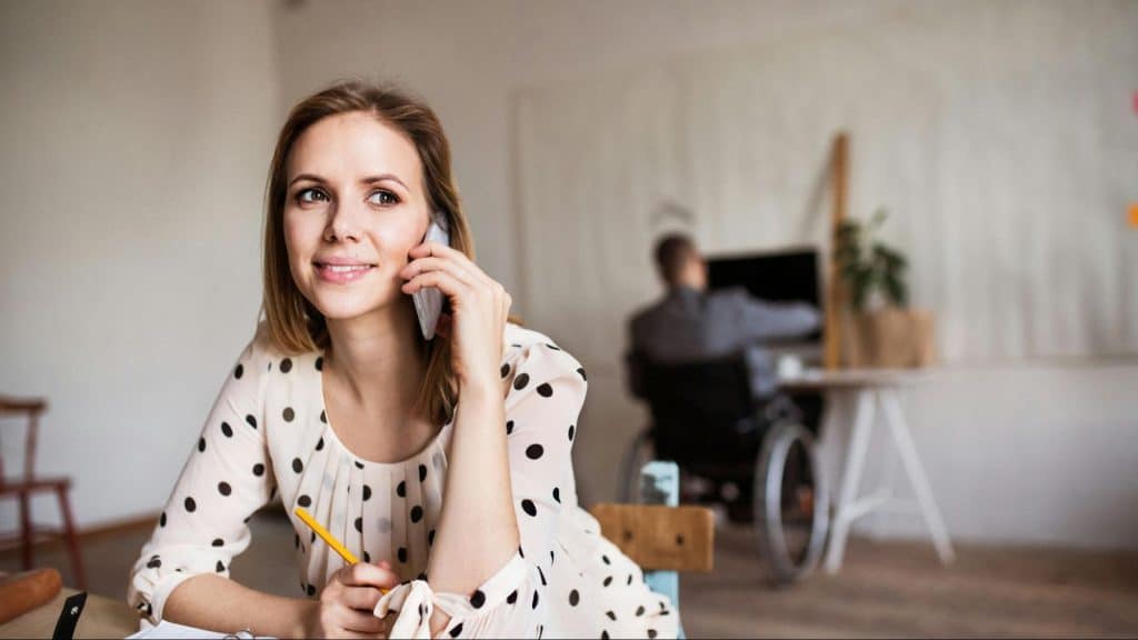 A man and woman busy with their work