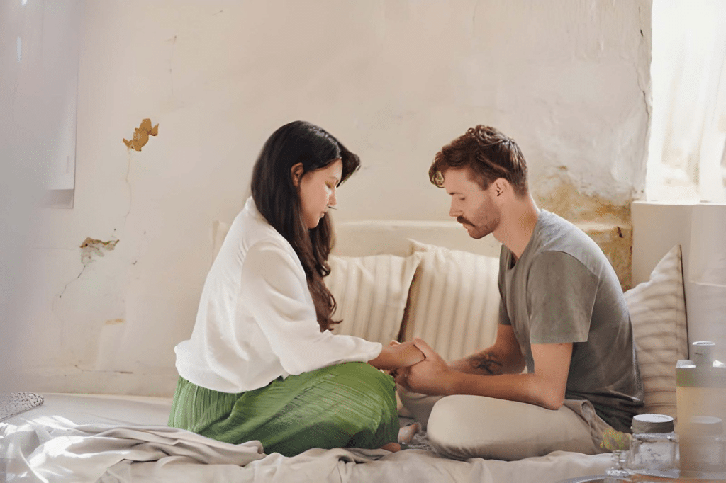 Couple having serious and calm conversation in bed