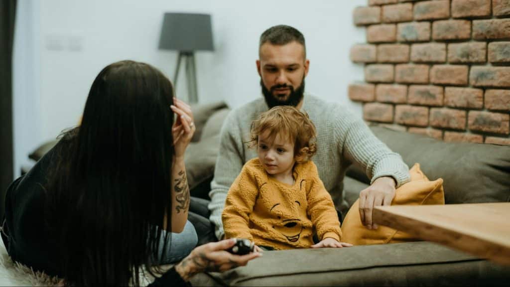 A man and woman with their child