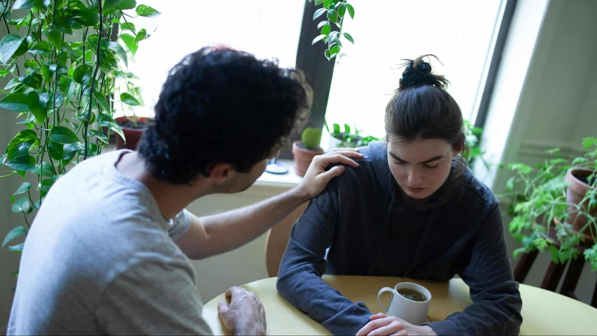 A man listening to woman