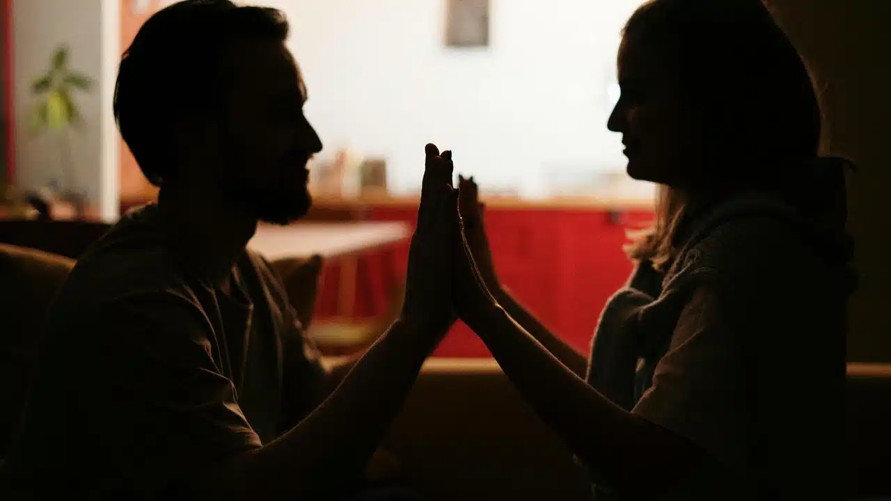 A couple sits facing each other