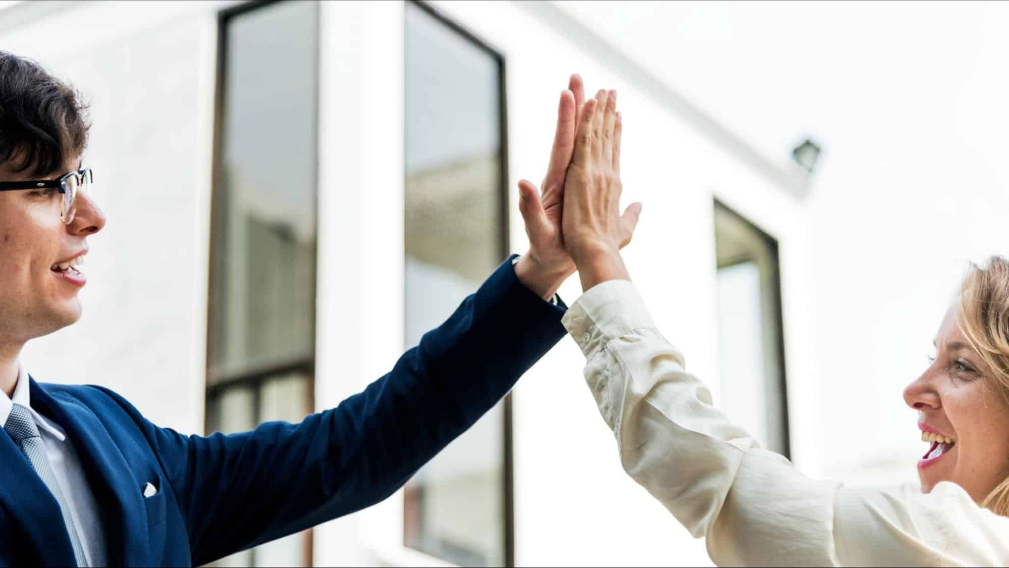 A man and woman doing high five