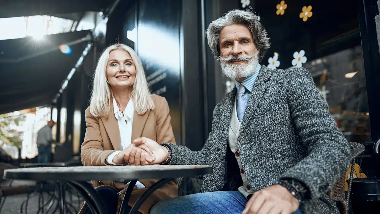 A mature couple having a date outdoors.