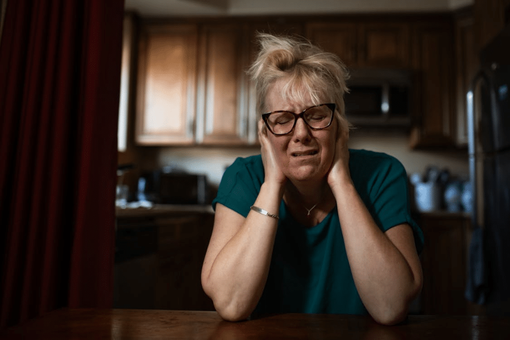 Portrait of a Woman Covering her Ears and Crying