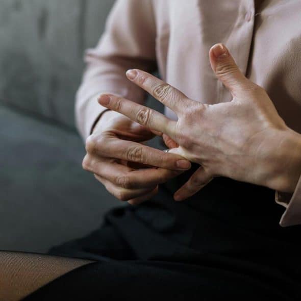 A woman taking off her ring