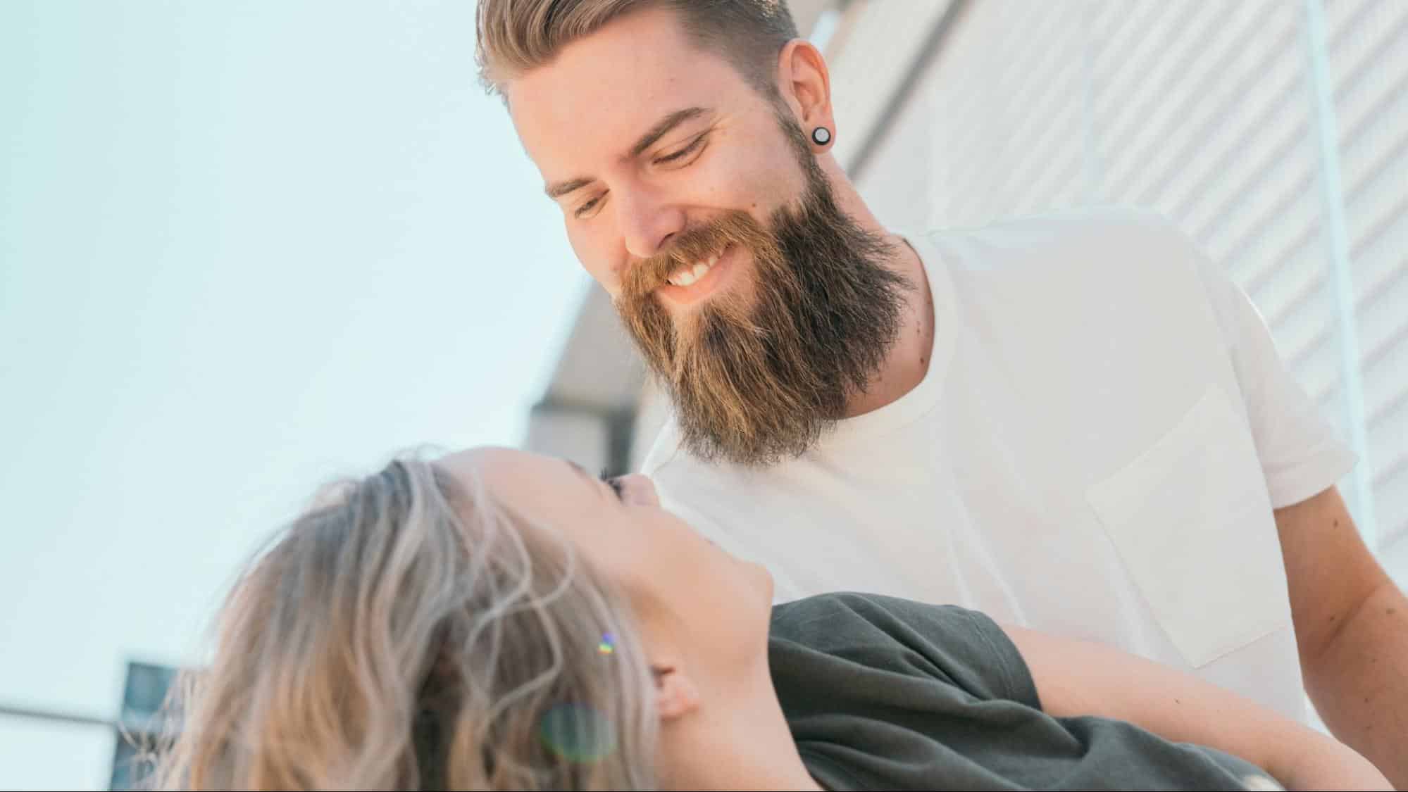 A man smiling to woman