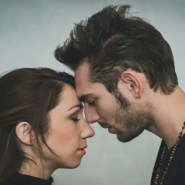 Man and woman touching foreheads.