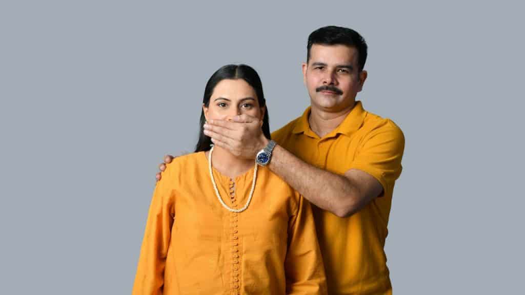 A man and woman posing for a picture.