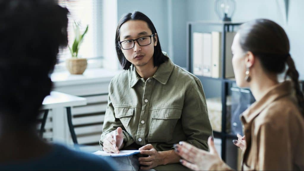 Woman talking to a man