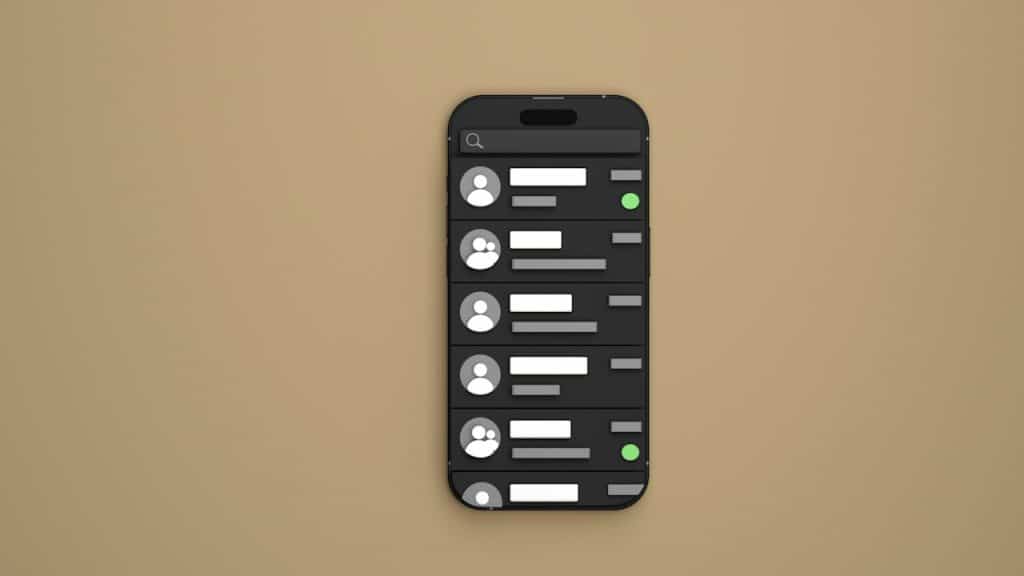 A cell phone sitting on top of a brown wall.