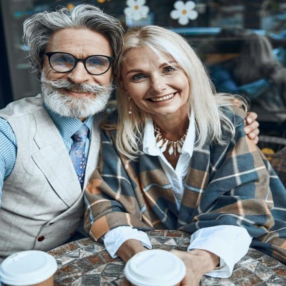 A beautiful mature couple having coffee together
