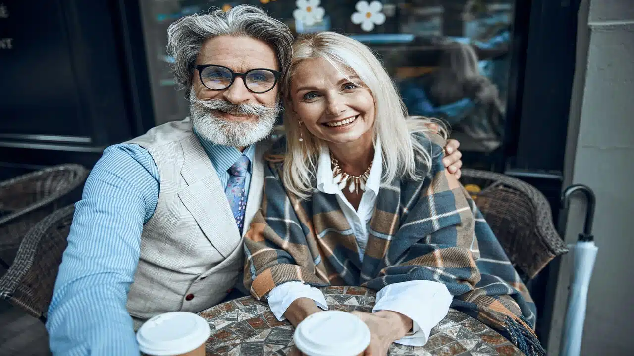 A beautiful mature couple having coffee together
