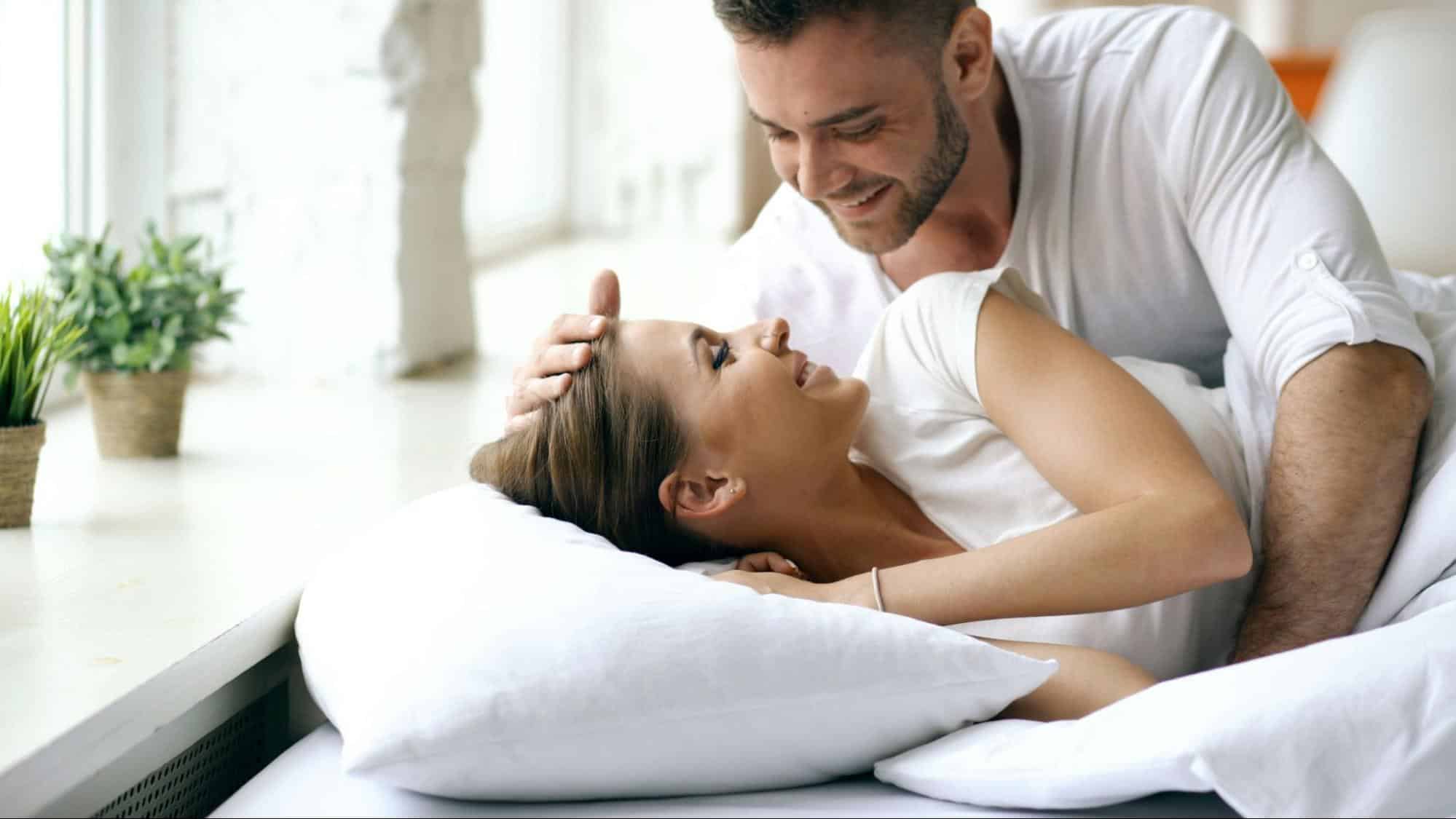 A man and women smiling at each other