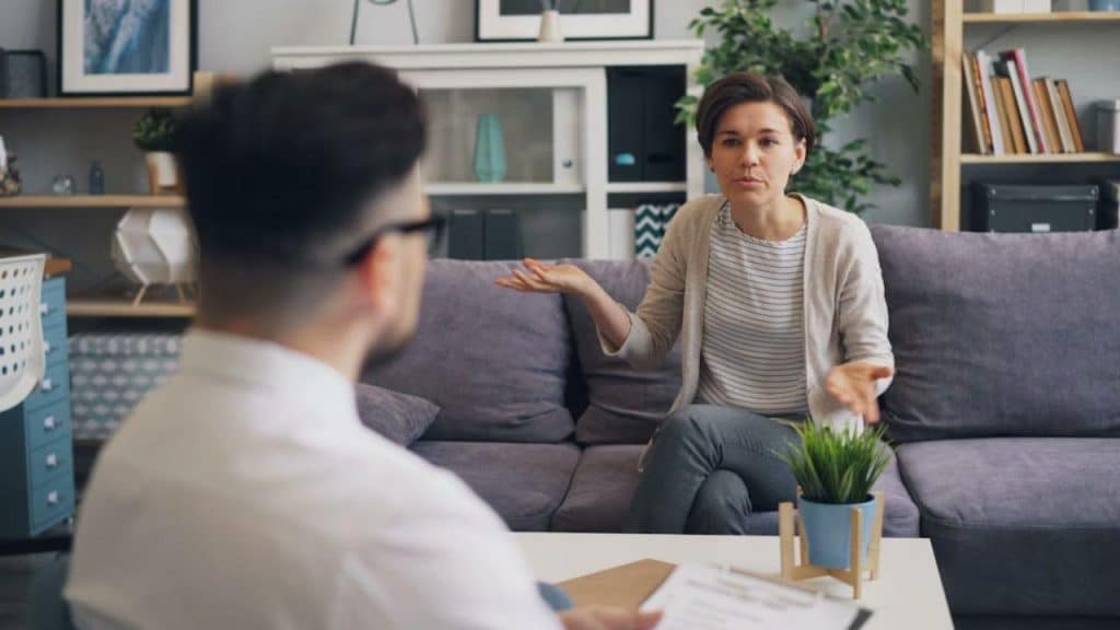 A woman is confused while the man speaks confidently.
