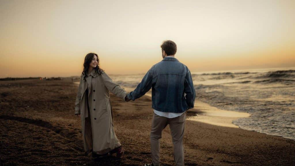 A man and woman holding hands