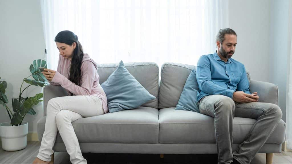 A man and woman uninterested with each other