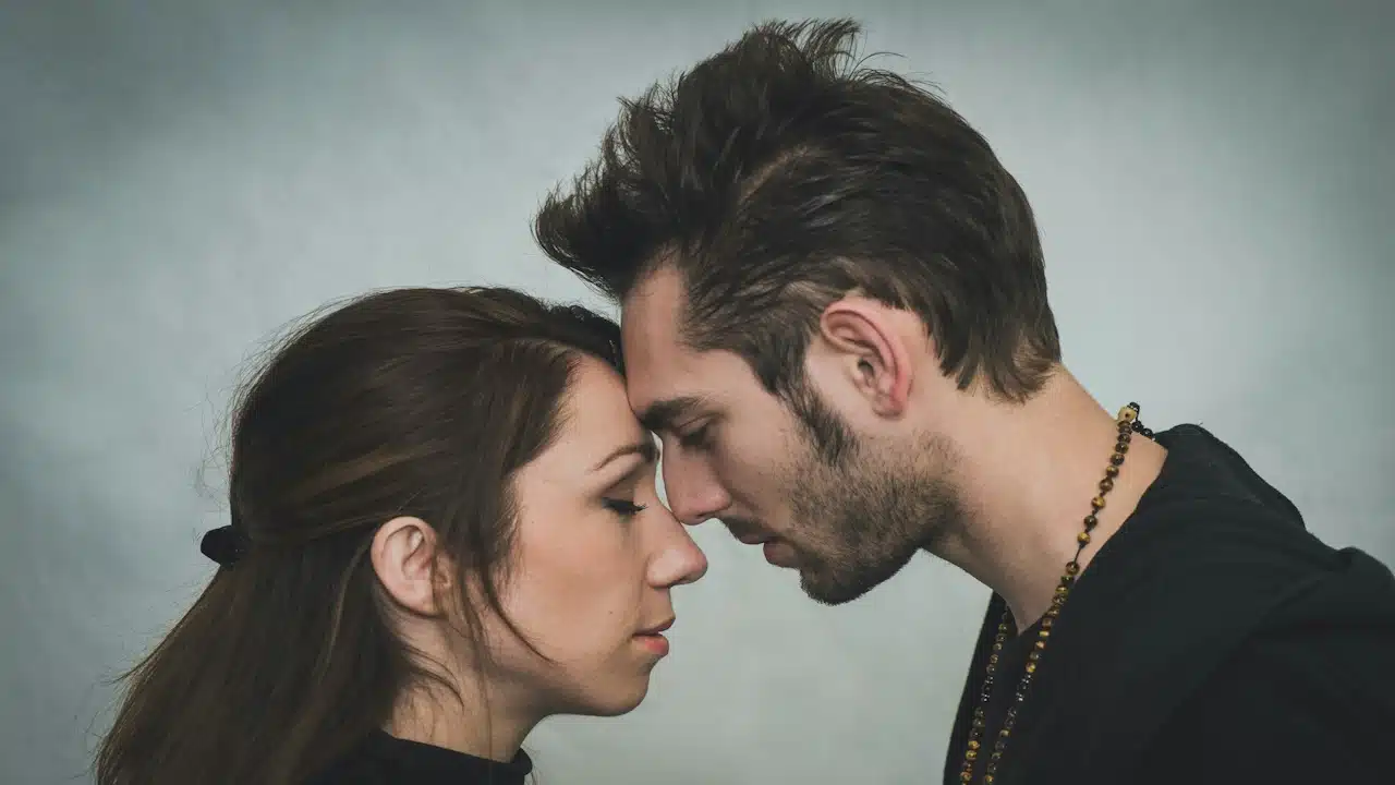 Man and woman touching foreheads.