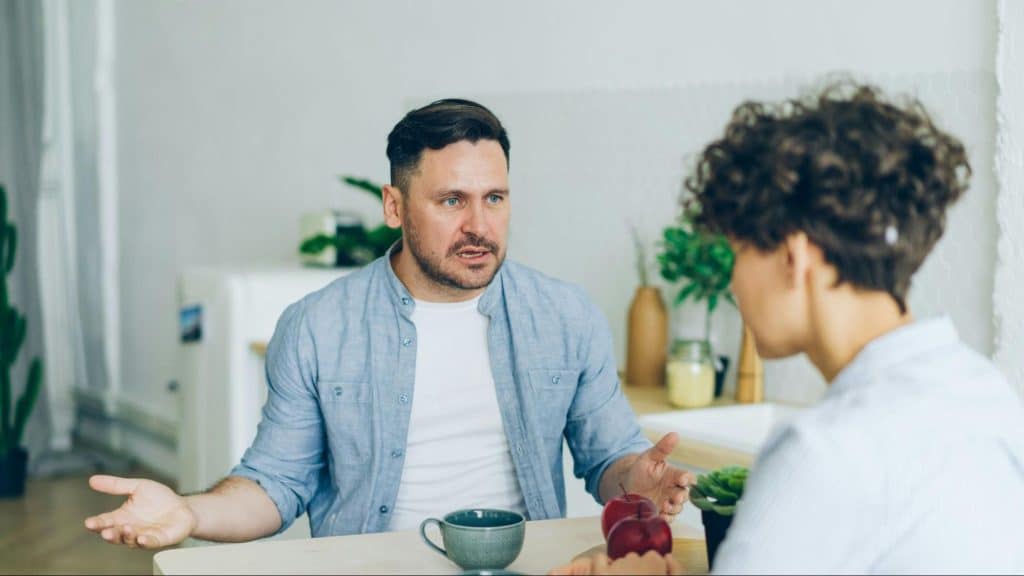 A man and woman talking