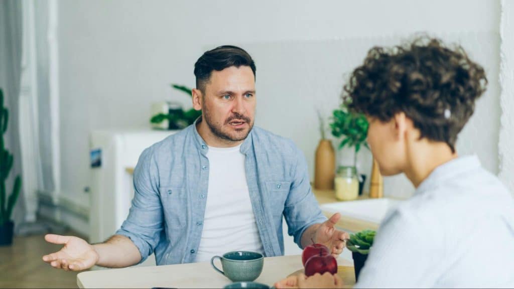 A man talking to woman