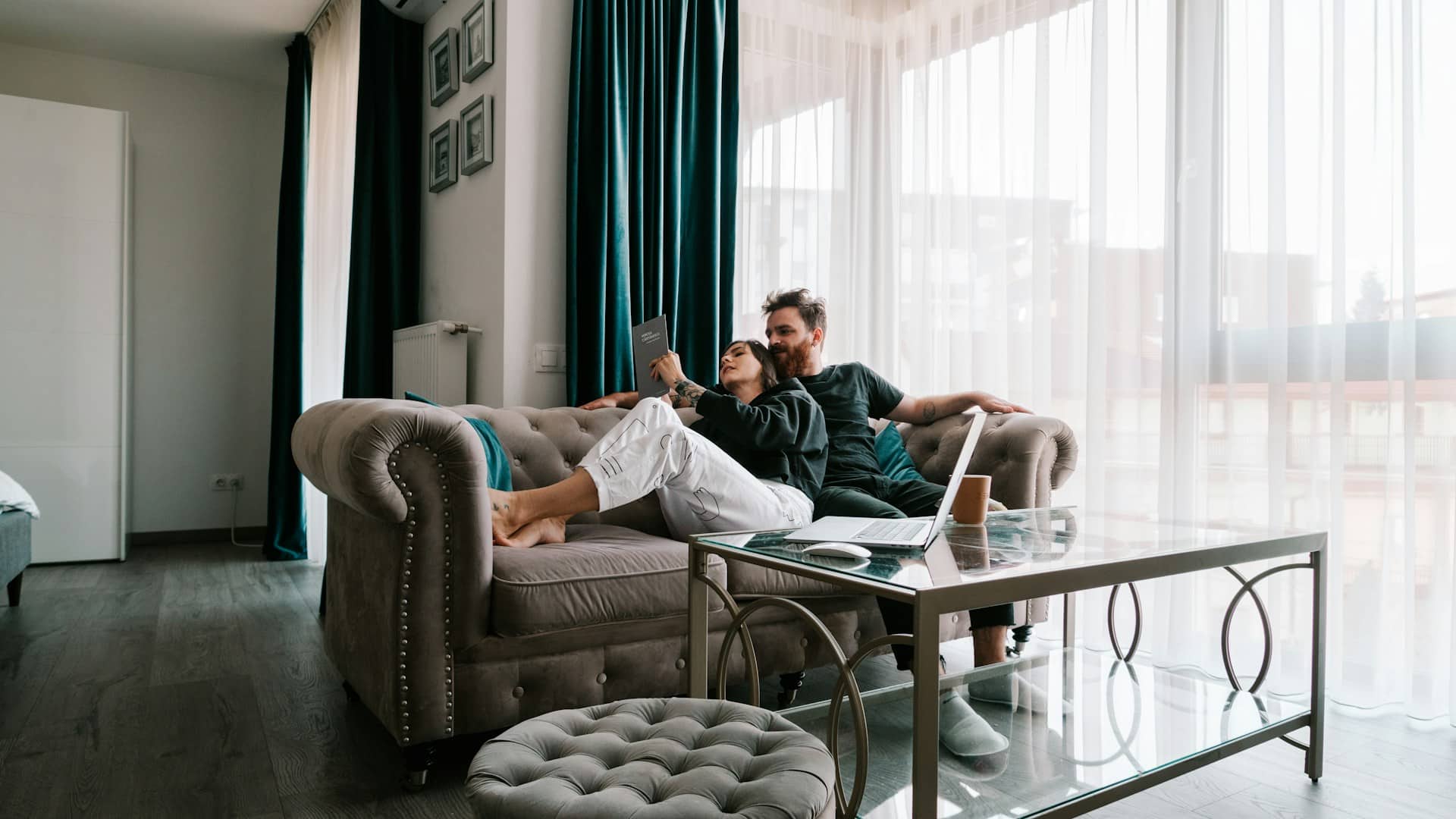 A couple reading in the living room.