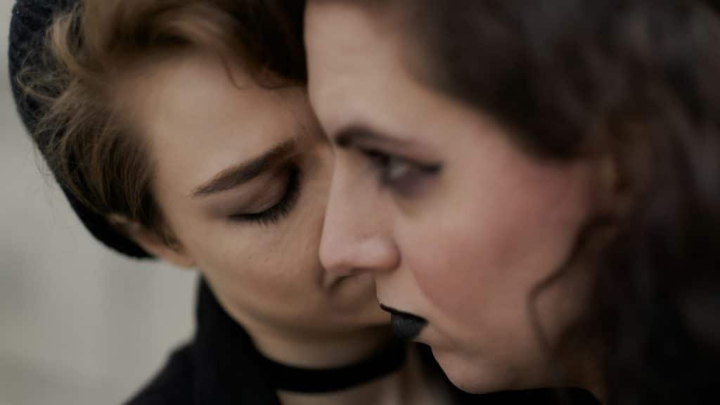 A closeup of a couple standing close to each other.