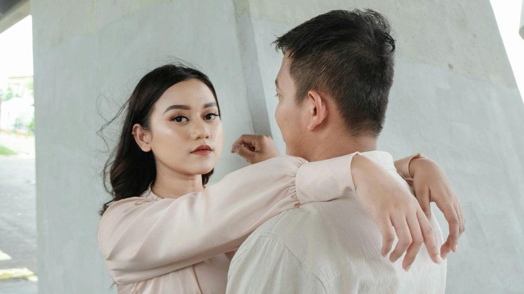 A man and a woman are standing next to each other.